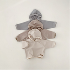 Cozy Monica Hoodie in neutral colors, perfect for babies and toddlers, showcasing stylish waffle texture.