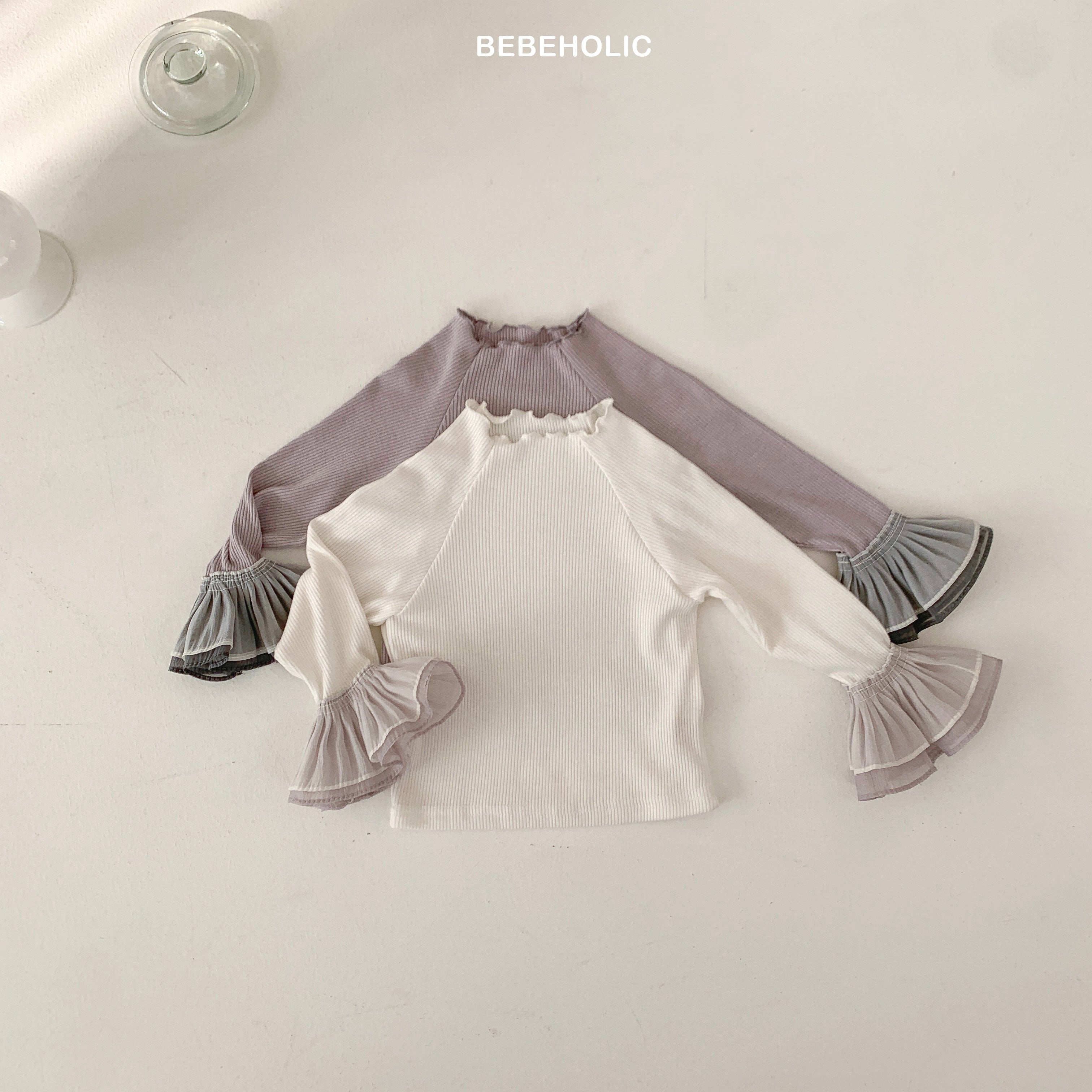 Stylish Double Frill Tee by Bebeholic featuring soft ribbed fabric and ruffled sleeves, perfect for baby comfort.