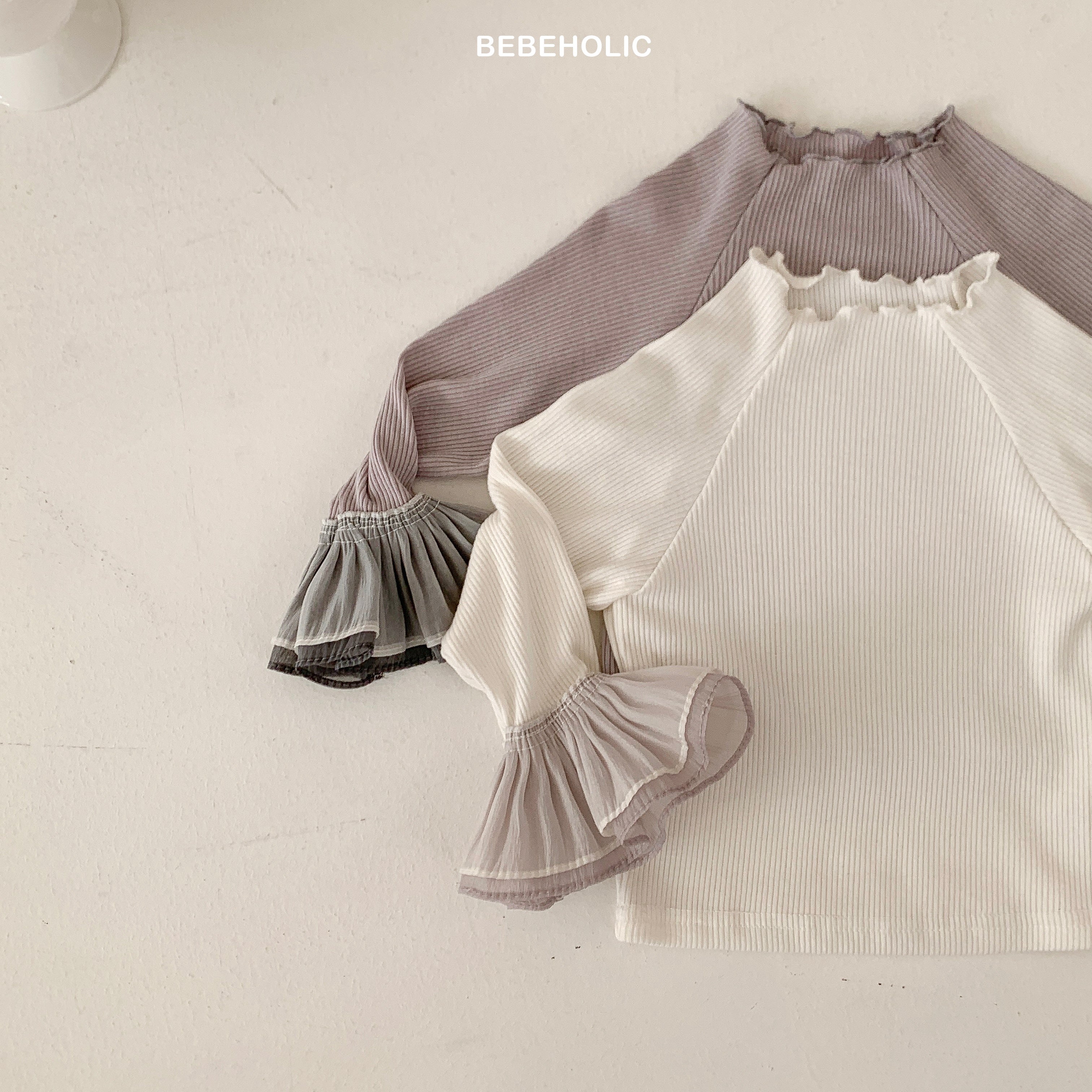 Stylish Double Frill Tee from Bebeholic, featuring soft fabric and delicate ruffles for baby comfort and style.