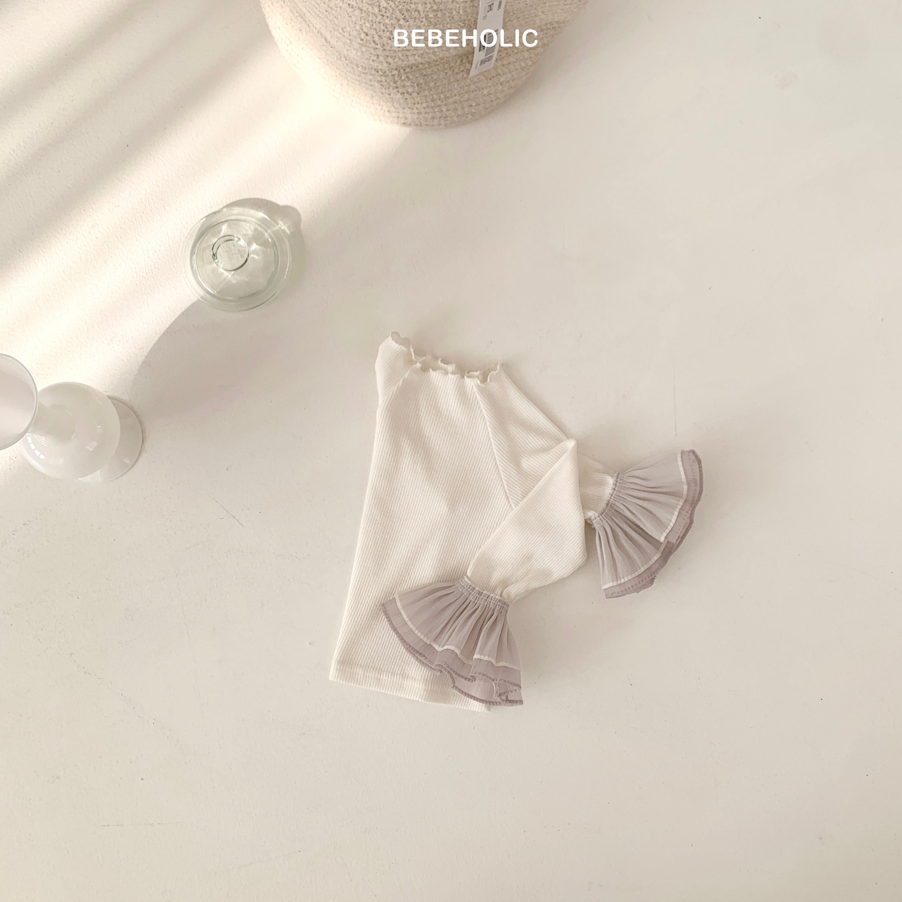 Stylish Double Frill Tee from Bebeholic features soft ruffles and breathable ribbed fabric for baby comfort.