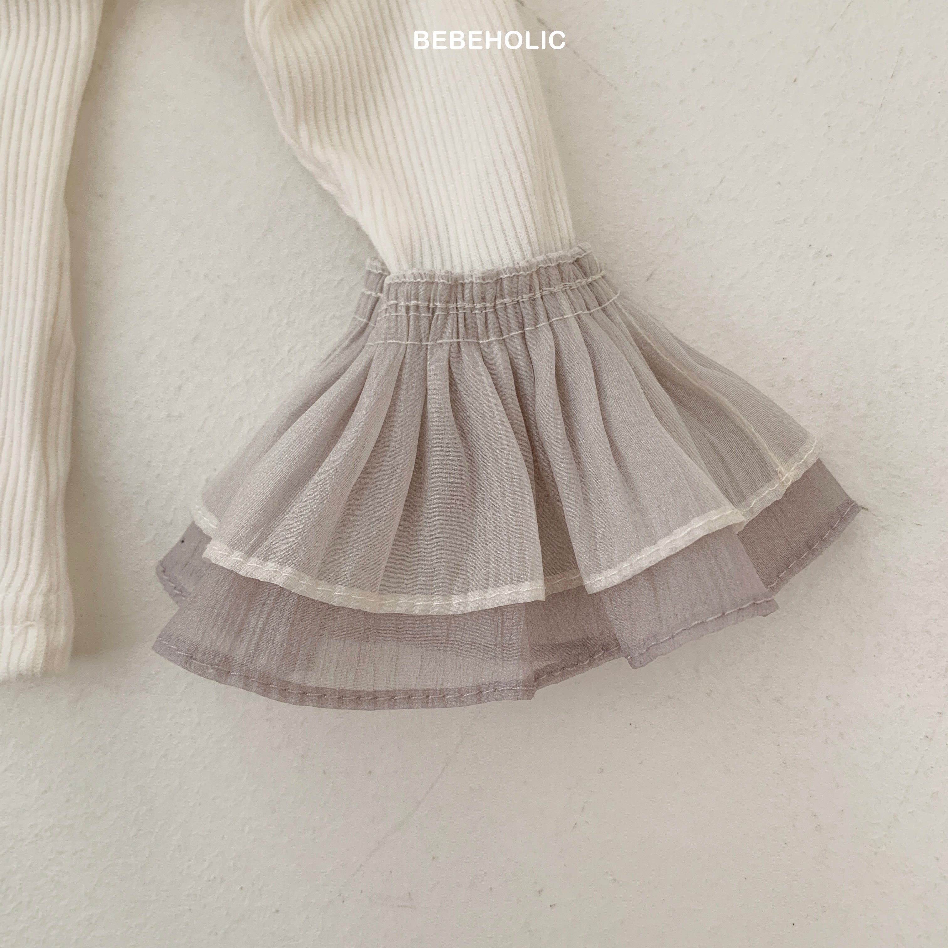Stylish Double Frill Tee by Bebeholic featuring soft, breathable fabric and elegant ruffled details. Perfect for babies!
